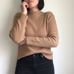 Light brown sweater with a slight turtle neck